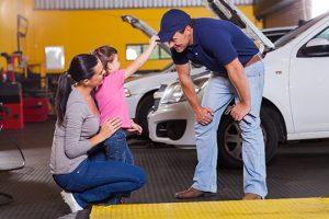 Family kid with Mechanic - Meineke Bolingbrook Illinois Meineke Car Care | ASE Certified | Bolingbrook